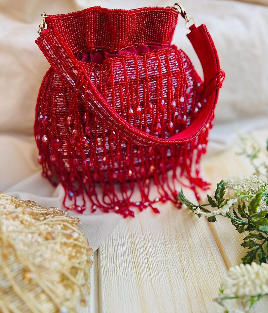 Meher hand-beaded potli in red with crystal drop fringe